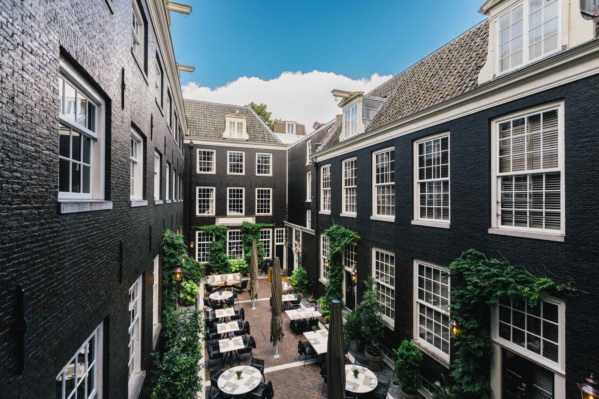 THe secluded garden of Bar Brasserie OCCO in luxury boutique hotel The Dylan Amsterdam